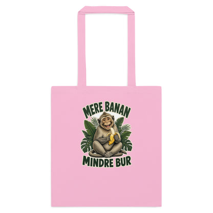 Mulepose med teksten Mere banan, mindre bur og en glad abe med en banan i farven lyserød, set forfra