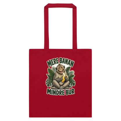 Mulepose med teksten Mere banan, mindre bur og en glad abe med en banan i farven rød, set forfra