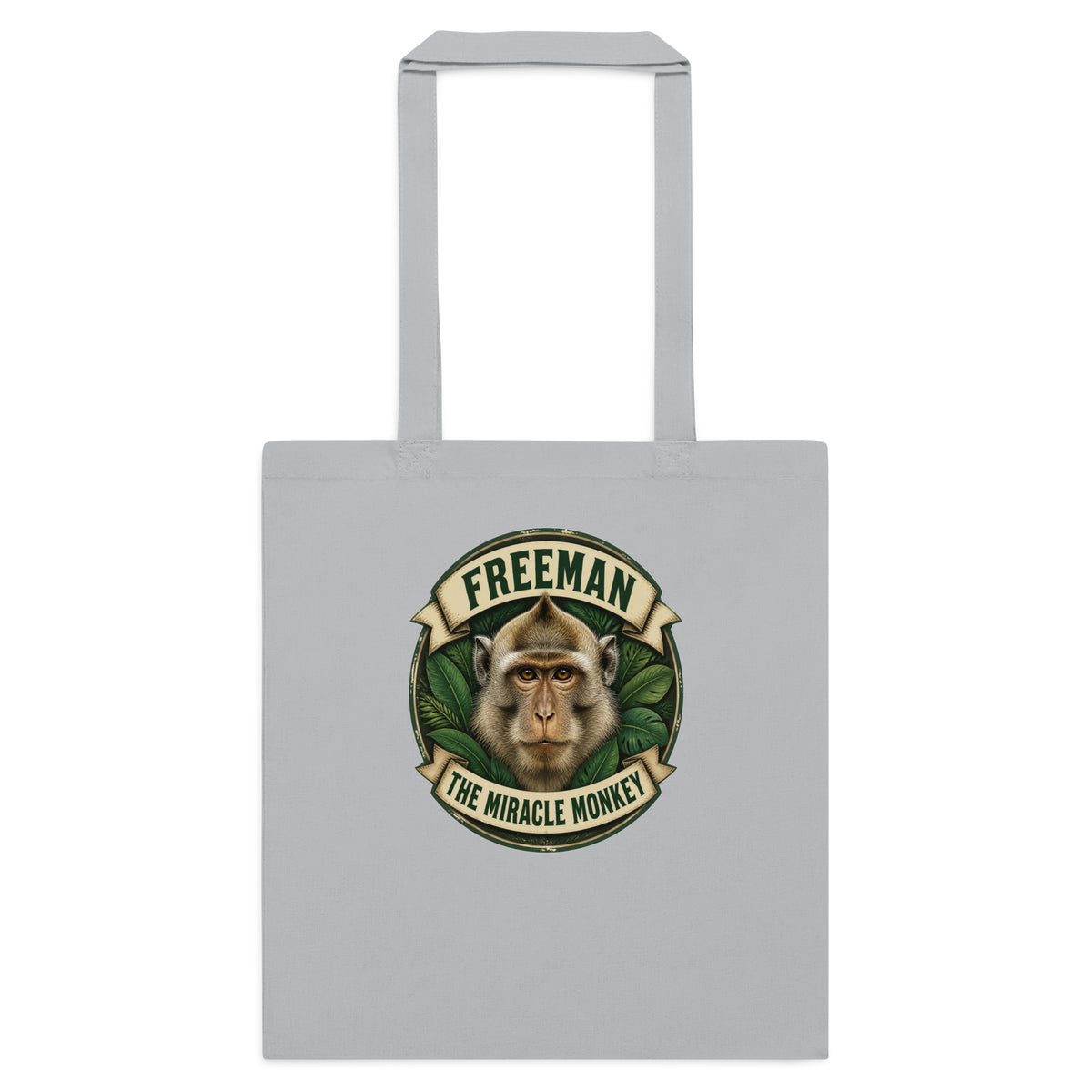 Mulepose med Freeman The Miracle Monkey badge med en abe i grønt i farven lysegrå, set forfra