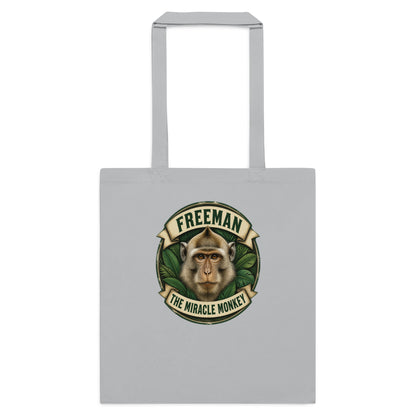 Mulepose med Freeman The Miracle Monkey badge med en abe i grønt i farven lysegrå, set forfra