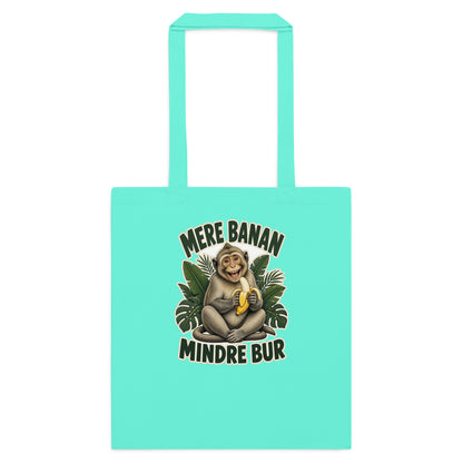 Mulepose med teksten Mere banan, mindre bur og en glad abe med en banan i farven mintgrøn, set forfra
