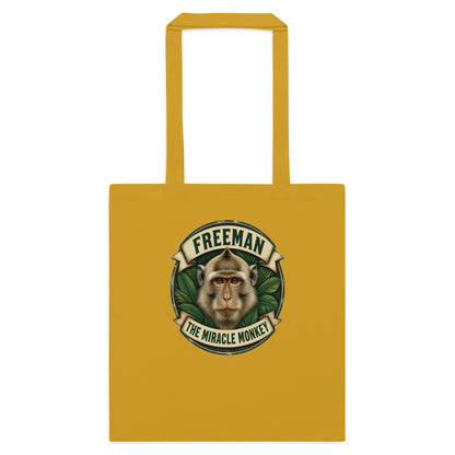 Mulepose med Freeman The Miracle Monkey badge med en abe i grønt i farven sennepsgul, set forfra