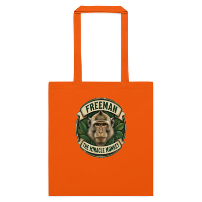 Mulepose med Freeman The Miracle Monkey badge med en abe i grønt i farven orange, set forfra