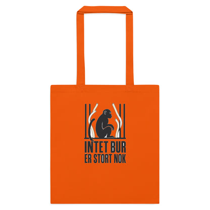 Mulepose med teksten Intet bur er stort nok og en abe bag tremmer i farven orange, set forfra