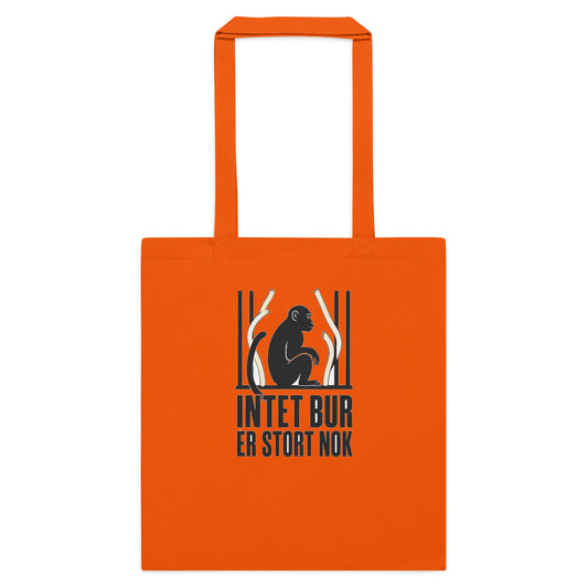 Mulepose med teksten Intet bur er stort nok og en abe bag tremmer i farven orange, set forfra