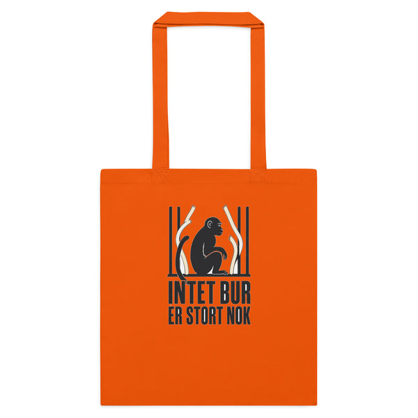 Mulepose med teksten Intet bur er stort nok og en abe bag tremmer i farven orange, set forfra