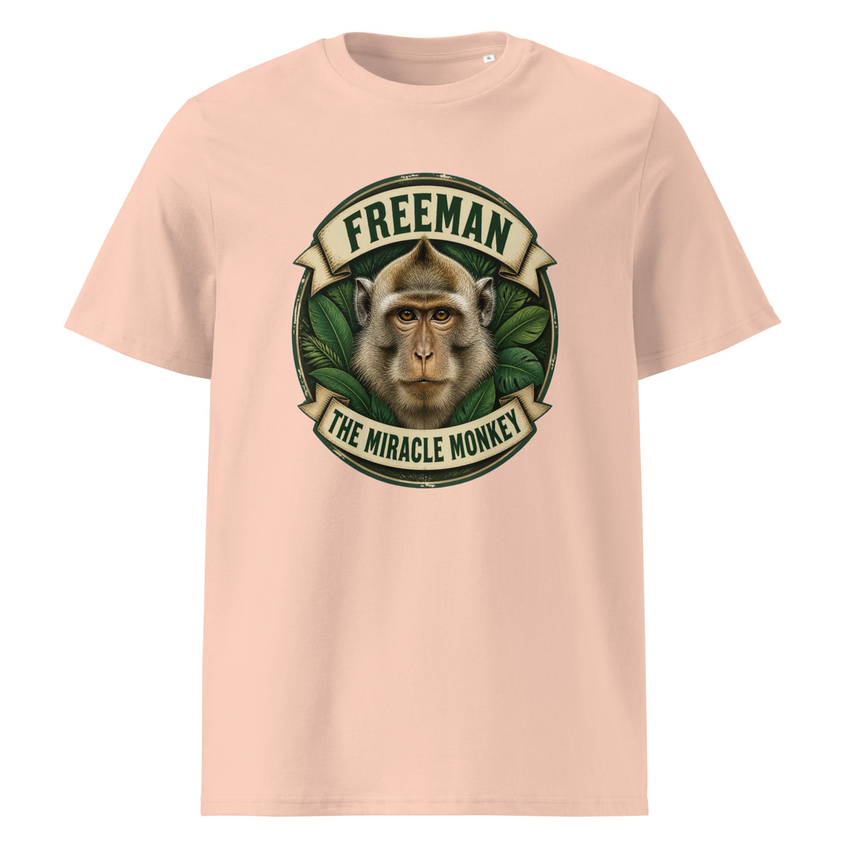 Freeman The Miracle Monkey t-shirt med abe i grønt badge i farven fersken, set forfra