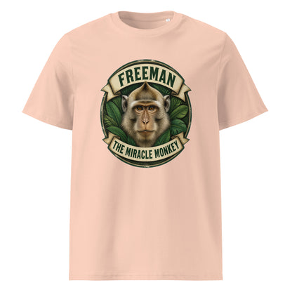 Freeman The Miracle Monkey t-shirt med abe i grønt badge i farven fersken, set forfra